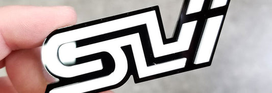 SLI Badge Made From Black and White Acrylic