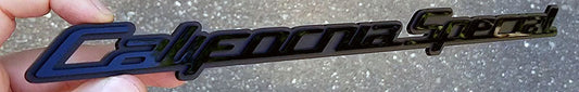 California Special automotive emblem in gloss and matte black layered finish made from UV rated acrylic held outdoors.