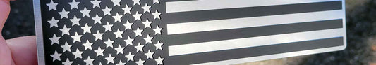 Low profile US flag emblem in brushed aluminum and satin black with horizontal grain finish.